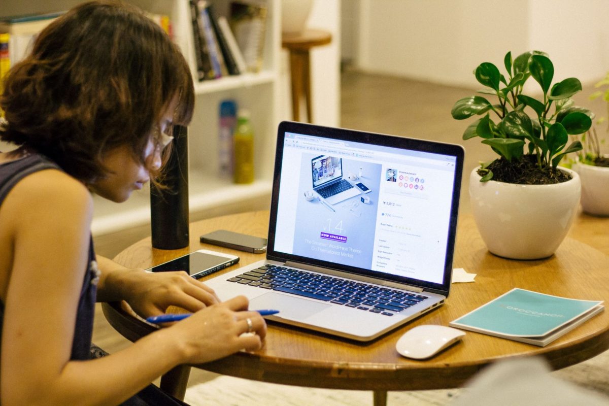 girl studying at desk using laptop